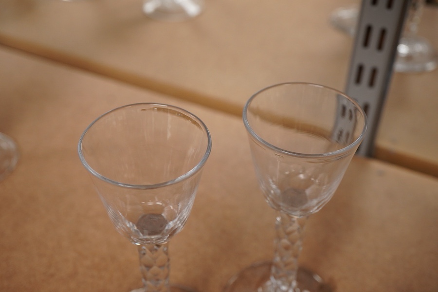 A pair of late 18th century wine glasses with faceted stems, 15cm high